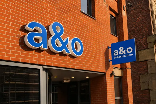 a&o letters and projecting sign on a brick building