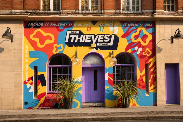 Four Thieves painted mural shop front